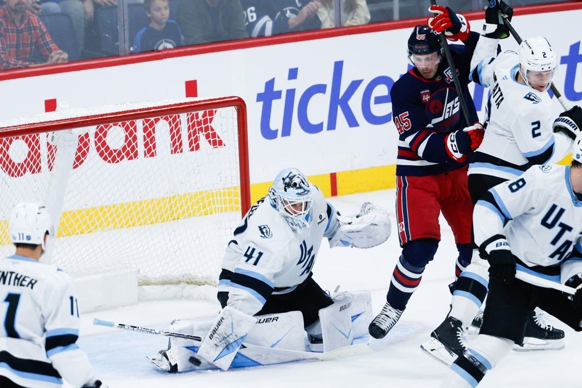 Oct 26, 2025; Winnipeg, Manitoba, CAN; Utah Mammoth goalie Vitek Vanecek (41) makes a save as Winnipeg Jets forward Cole Koepke (45) looks for a rebound during the third period at Canada Life Centre. Mandatory Credit: Terrence Lee-Imagn Images