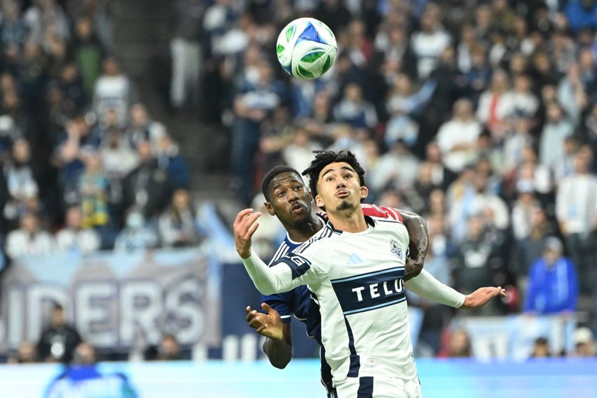Oct 26, 2025; Vancouver, British Columbia, CAN; FC Dallas defender Osaze Urhoghide (3) battles for the ball against Vancouver Whitecaps FC forward Rayan Elloumi (75) during the second half at BC Place. Mandatory Credit: Simon Fearn-Imagn Images