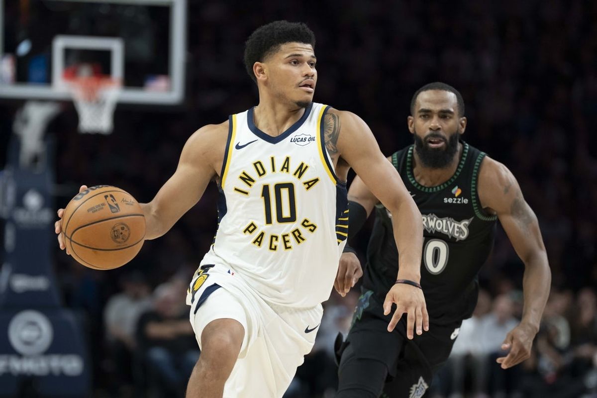 Oct 26, 2025; Minneapolis, Minnesota, USA; Indiana Pacers guard RayJ Dennis (10) dribbles the ball as Minnesota Timberwolves guard Mike Conley (10) plays defense in the second half at Target Center. Mandatory Credit: Jesse Johnson-Imagn Images