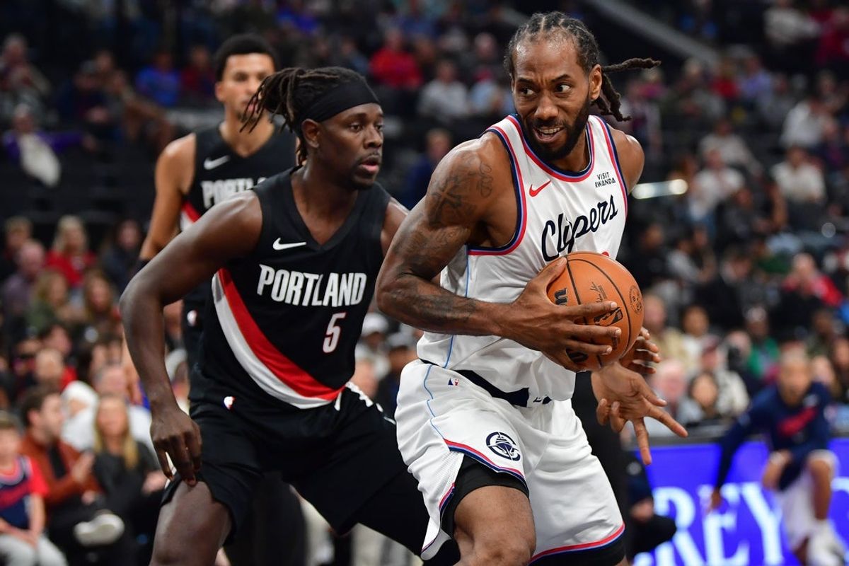 Oct 26, 2025; Inglewood, California, USA; Los Angeles Clippers forward Kawhi Leonard (2) moves the ball against Portland Trail Blazers guard Jrue Holiday (5) during the first half at Intuit Dome. Mandatory Credit: Gary A. Vasquez-Imagn Images