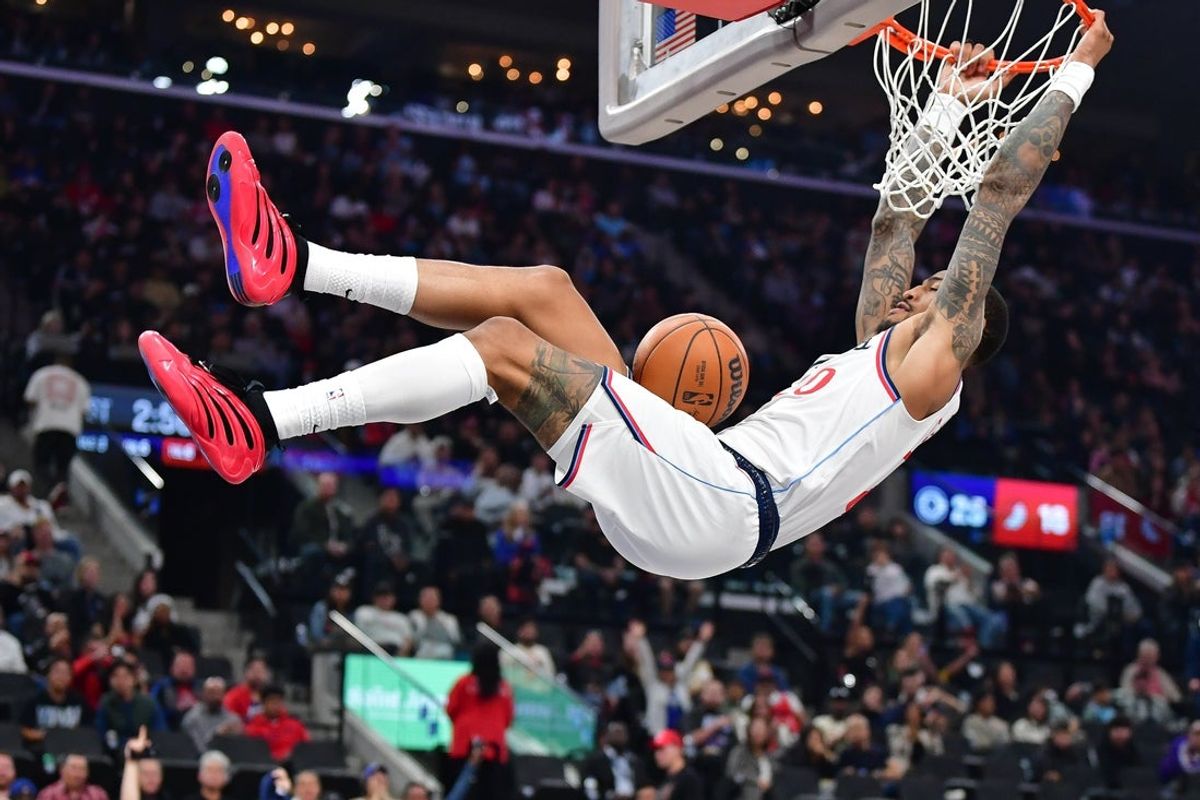 Oct 26, 2025; Inglewood, California, USA; Los Angeles Clippers forward John Collins (20) dunks for the basket against the Portland Trail Blazers during the first half at Intuit Dome. Mandatory Credit: Gary A. Vasquez-Imagn Images