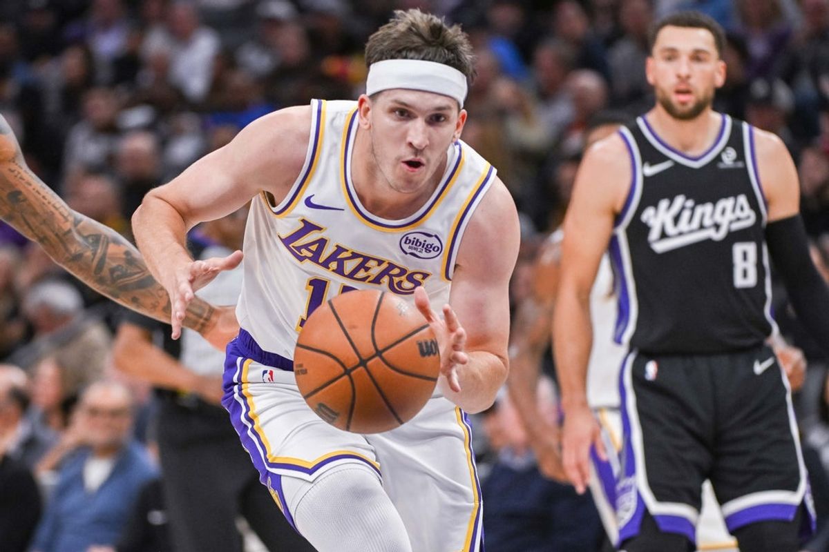 Oct 26, 2025; Sacramento, California, USA; Los Angeles Lakers guard Austin Reaves (15) drives to the basket during the second quarter against the Sacramento Kings at Golden 1 Center. Mandatory Credit: Ed Szczepanski-Imagn Images