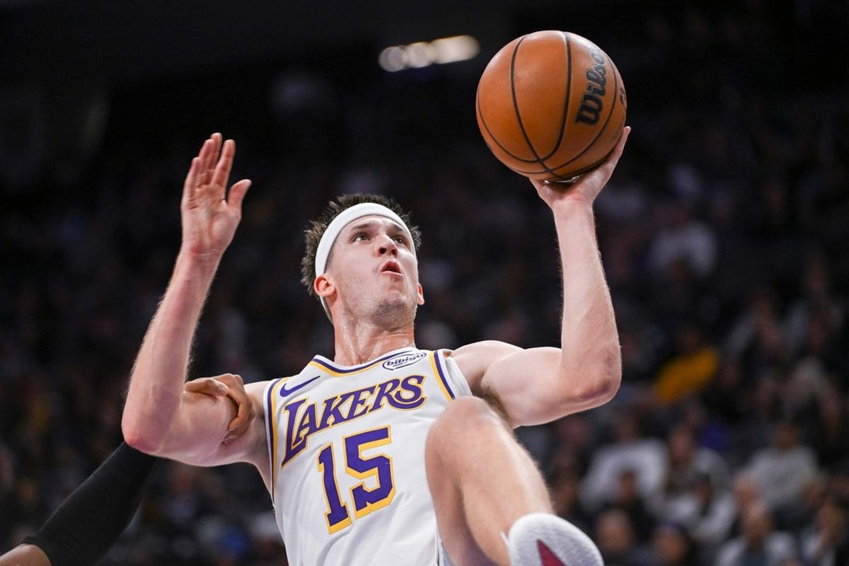 Oct 26, 2025; Sacramento, California, USA; Los Angeles Lakers guard Austin Reaves (15) is fouled on the shot during the second quarter of the game against the Sacramento Kings at Golden 1 Center. Mandatory Credit: Ed Szczepanski-Imagn Images