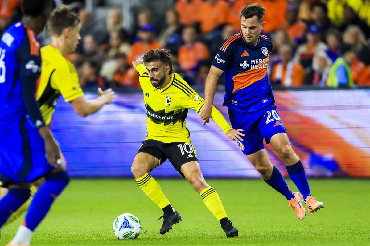 Oct 27, 2025; Cincinnati, Ohio, USA; Columbus Crew forward Diego Rossi (10) battles for the ball against FC Cincinnati midfielder Pavel Bucha (20) in the first half at TQL Stadium. Mandatory Credit: Katie Stratman-Imagn Images