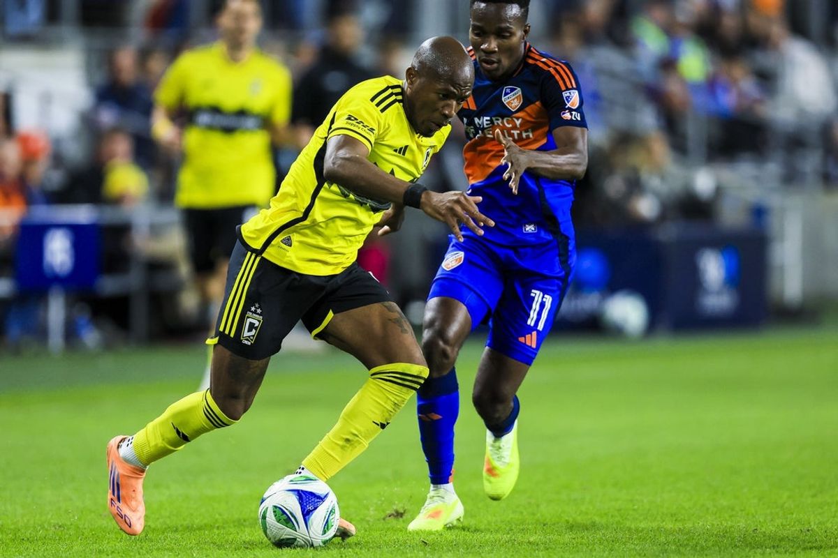 Oct 27, 2025; Cincinnati, Ohio, USA; Columbus Crew midfielder Darlington Nagbe (6) dribbles against FC Cincinnati midfielder Samuel Gidi (11) in the second half at TQL Stadium. Mandatory Credit: Katie Stratman-Imagn Images