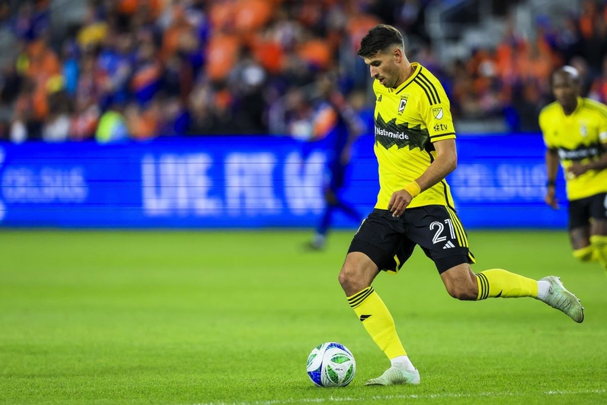 Oct 27, 2025; Cincinnati, Ohio, USA; Columbus Crew defender Yevhen Cheberko (21) dribbles against FC Cincinnati in the second half at TQL Stadium. Mandatory Credit: Katie Stratman-Imagn Images