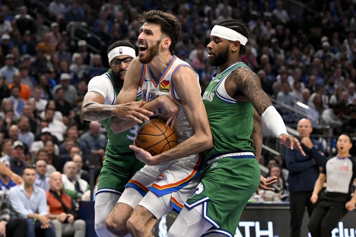Oct 27, 2025; Dallas, Texas, USA; Oklahoma City Thunder center Chet Holmgren (7) is fouled by Dallas Mavericks forward Anthony Davis (3) as guard Jaden Hardy (1) looks on during the second quarter at the American Airlines Center. Mandatory Credit: Jerome Miron-Imagn Images