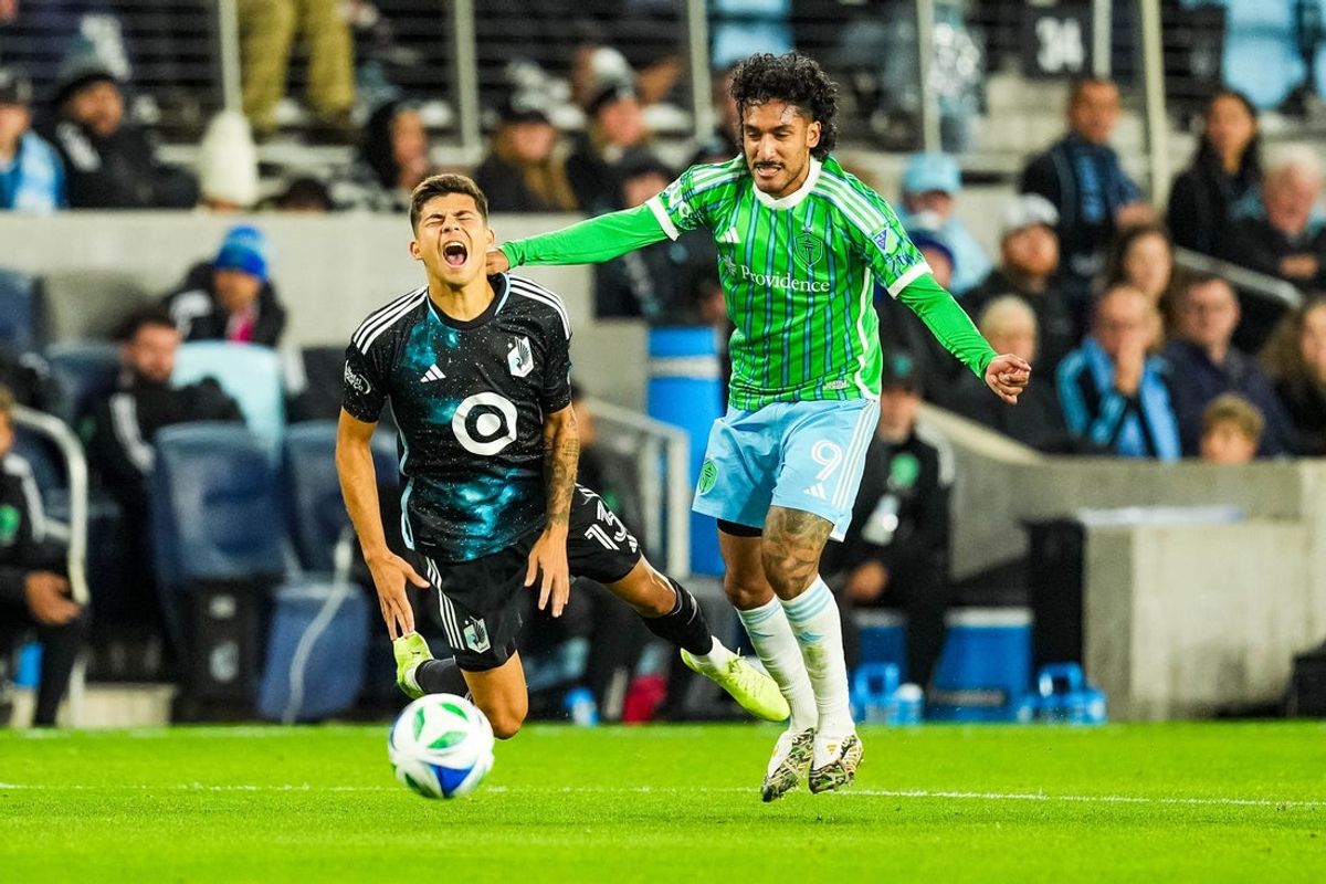 Oct 27, 2025; Saint Paul, Minnesota, USA; Seattle Sounders forward Jesus Ferreira (9) fouls Minnesota United defender Anthony Markanich (13) during the first half  at Allianz Field. Mandatory Credit: Brace Hemmelgarn-Imagn Images