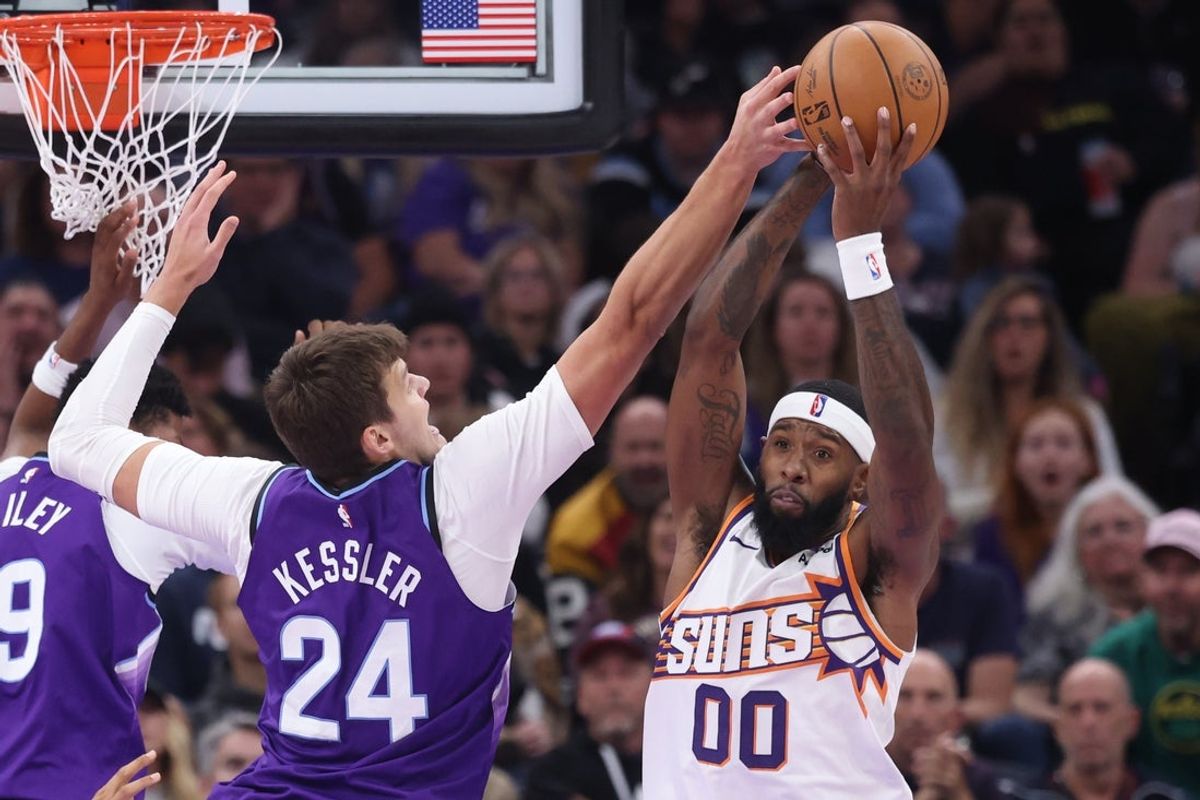 Oct 27, 2025; Salt Lake City, Utah, USA; Utah Jazz center Walker Kessler (24) and Phoenix Suns forward Royce O'Neale (00) battle for a rebound during the second quarter at Delta Center. Mandatory Credit: Rob Gray-Imagn Images