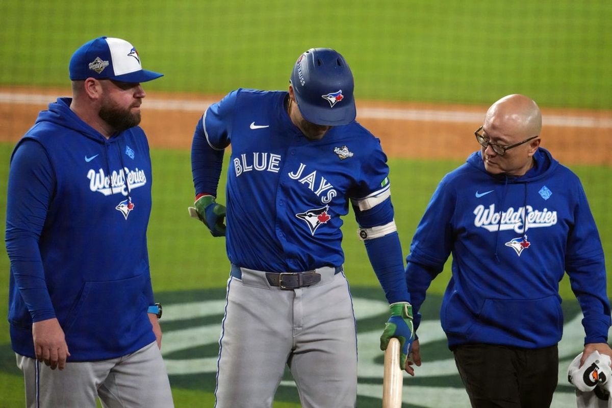 Oct 27, 2025; Los Angeles, California, USA; Toronto Blue Jays right fielder George Springer (4) leaves the game after an apparent injury in the seventh inning against the Los Angeles Dodgers during game three of the 2025 MLB World Series at Dodger Stadium. Mandatory Credit: Kirby Lee-Imagn Images
