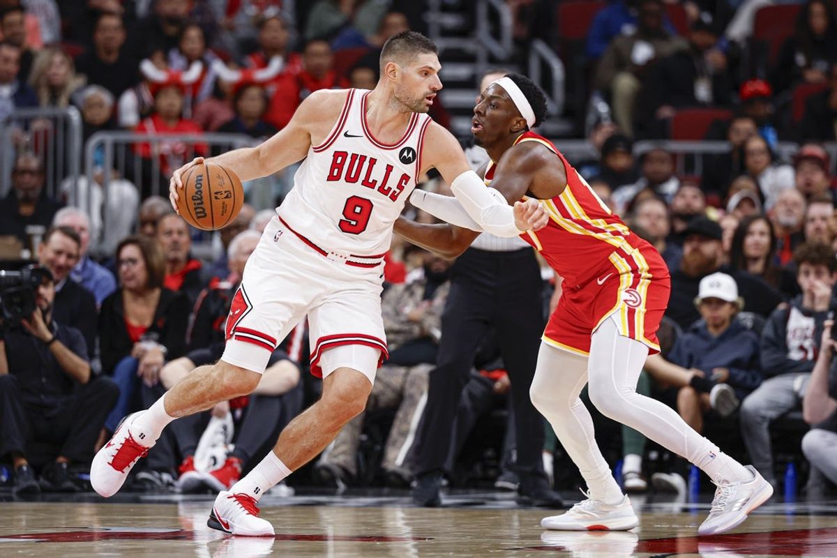 Oct 27, 2025; Chicago, Illinois, USA; Atlanta Hawks forward Onyeka Okongwu (17) defends against Chicago Bulls center Nikola Vucevic (9) during the second half at United Center. Mandatory Credit: Kamil Krzaczynski-Imagn Images