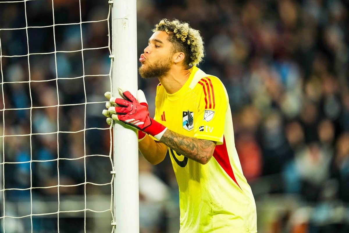 Oct 27, 2025; Saint Paul, Minnesota, USA; Minnesota United goalkeeper Dayne St. Clair (97) celebrates and kisses the post following the shootout against Seattle Sounders at Allianz Field. Mandatory Credit: Brace Hemmelgarn-Imagn Images