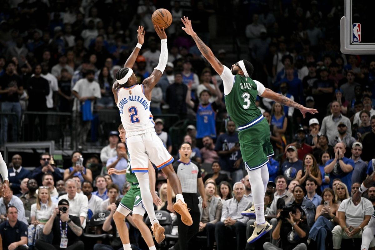 Oct 27, 2025; Dallas, Texas, USA; Oklahoma City Thunder guard Shai Gilgeous-Alexander (2) makes a jump shot over Dallas Mavericks forward Anthony Davis (3) during the second half at the American Airlines Center. Mandatory Credit: Jerome Miron-Imagn Images