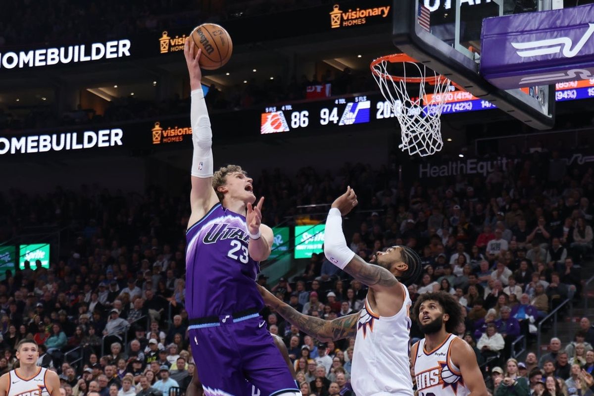 Oct 27, 2025; Salt Lake City, Utah, USA; Utah Jazz forward Lauri Markkanen (23) shoots over Phoenix Suns center Nick Richards (2) during the second half at Delta Center. Mandatory Credit: Rob Gray-Imagn Images