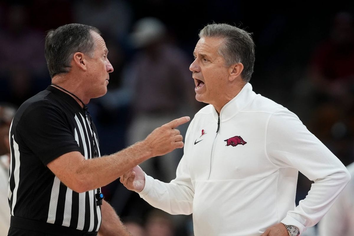 Arkansas' head coach John Calipari speaks to an official during the exhibition game between Arkansas and Memphis during the Hoops for St. Jude Tip Off Classic at FedExForum on October 27, 2025.