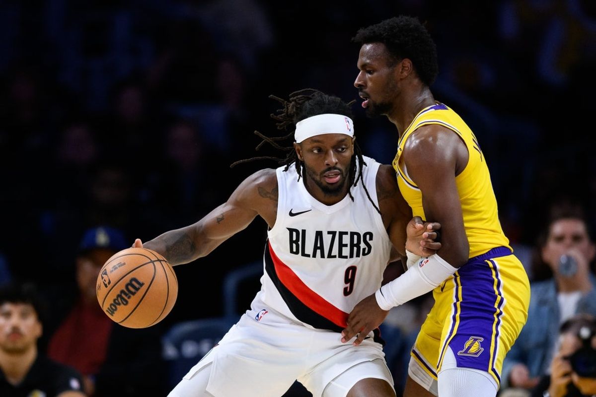 Oct 27, 2025; Los Angeles, California, USA; Portland Trail Blazers forward Jerami Grant (9) drives the ball against Los Angeles Lakers guard Bronny James (9) during the second half at Crypto.com Arena. Mandatory Credit: William Liang-Imagn Images