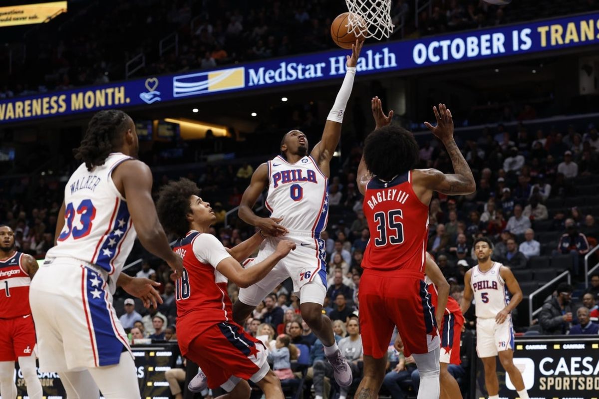 Oct 28, 2025; Washington, District of Columbia, USA; Philadelphia 76ers guard Tyrese Maxey (0) shoots the ball as Washington Wizards forward Marvin Bagley III (35) defends in the first half at Capital One Arena. Mandatory Credit: Geoff Burke-Imagn Images