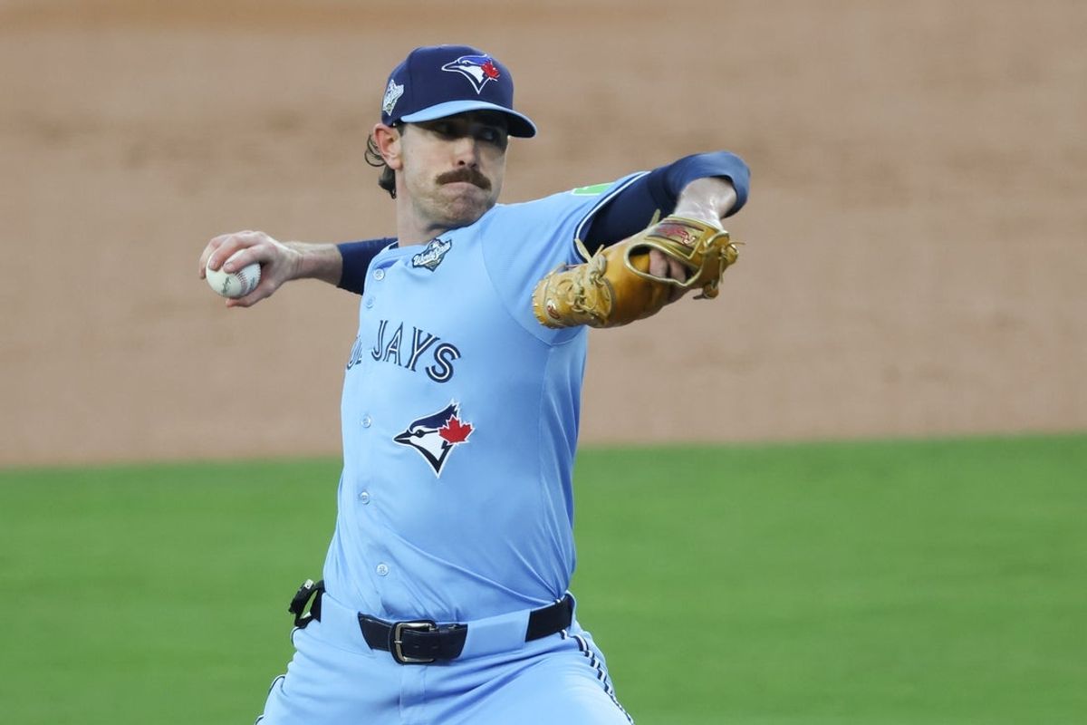 Oct 28, 2025; Los Angeles, California, USA; Toronto Blue Jays pitcher Shane Bieber (57) pitches during the first inning against the Los Angeles Dodgers during game four of the 2025 MLB World Series at Dodger Stadium. Mandatory Credit: Kiyoshi Mio-Imagn Images