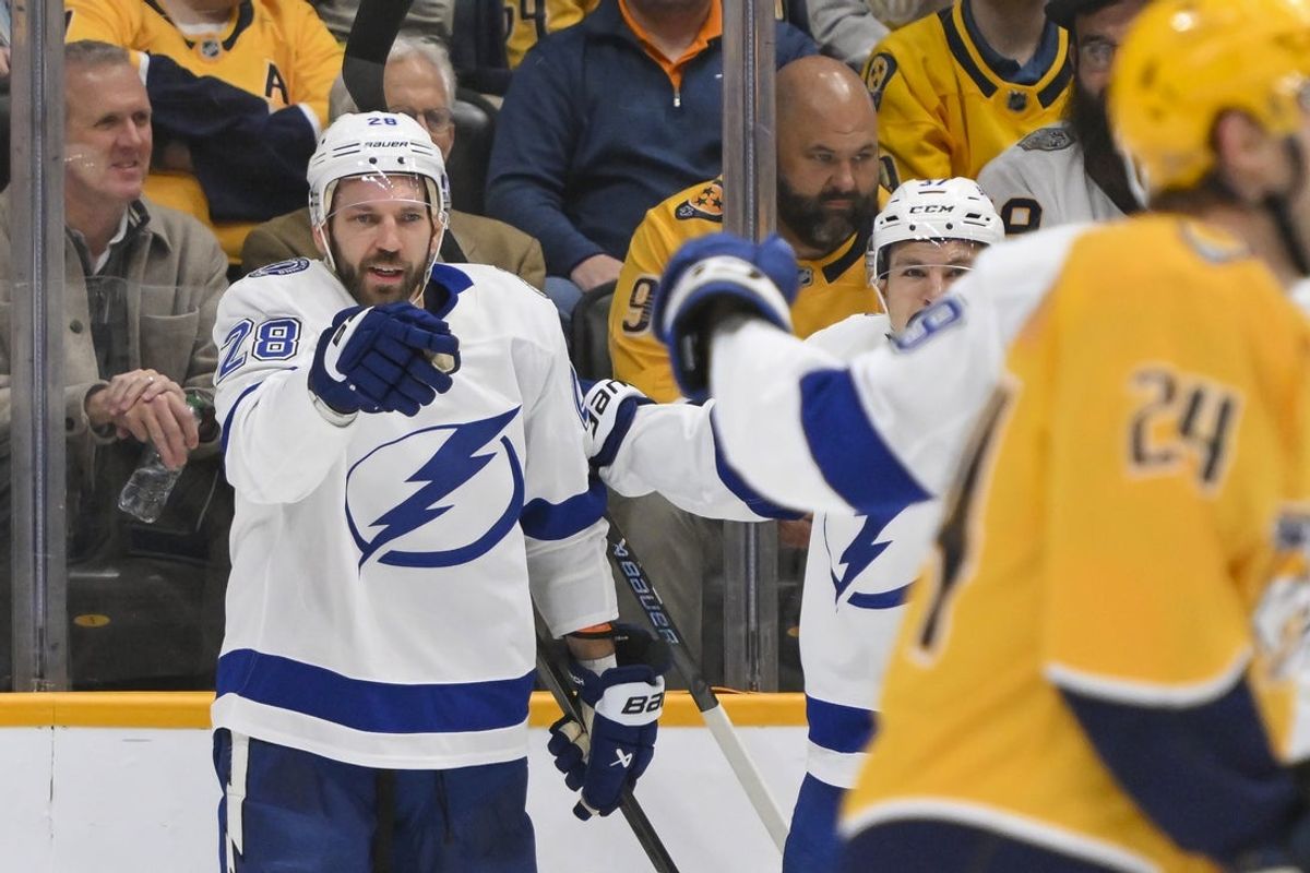 Oct 28, 2025; Nashville, Tennessee, USA;  Tampa Bay Lightning center Zemgus Girgensons (28) celebrates his goal against the Nashville Predators during the first period at Bridgestone Arena. Mandatory Credit: Steve Roberts-Imagn Images