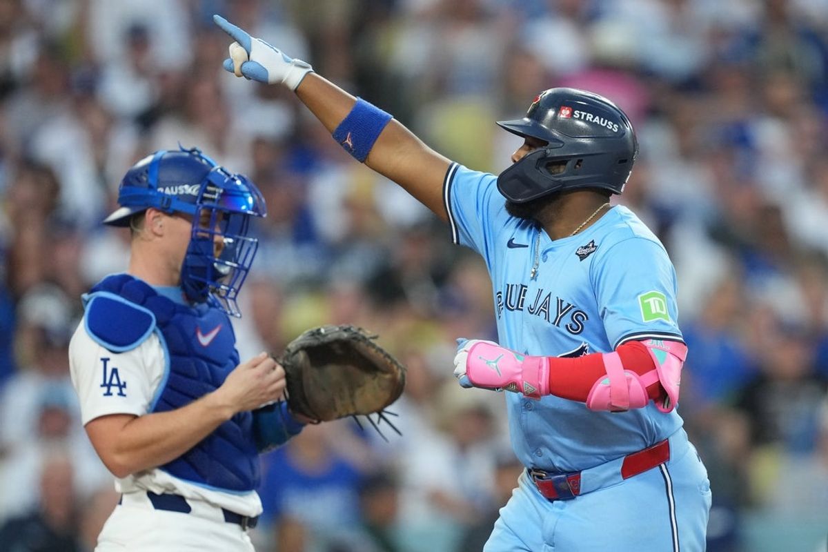 Oct 28, 2025; Los Angeles, California, USA; Toronto Blue Jays first baseman Vladimir Guerrero Jr. (27) celebrates after hitting a two run home run against the Los Angeles Dodgers in the third inning during game four of the 2025 MLB World Series at Dodger Stadium. Mandatory Credit: Kirby Lee-Imagn Images