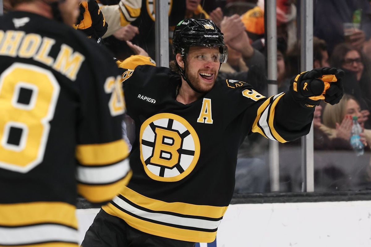 Oct 28, 2025; Boston, Massachusetts, USA; Boston Bruins right wing David Pastrnak (88) points to a teammate after scoring against the New York Islanders during the second period at TD Garden. Mandatory Credit: Winslow Townson-Imagn Images