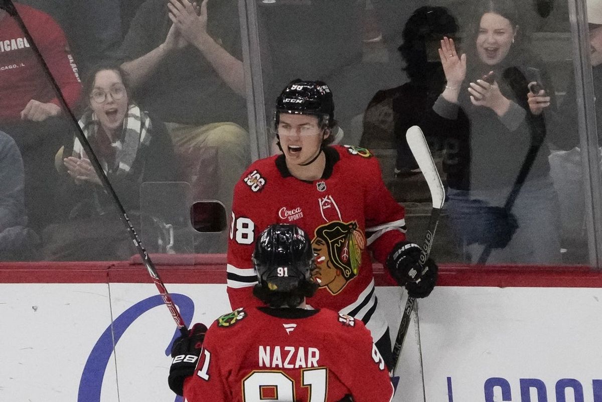 Oct 28, 2025; Chicago, Illinois, USA; Chicago Blackhawks center Connor Bedard (98) celebrates his goal against the Ottawa Senators with center Frank Nazar (91) during the first period at United Center. Mandatory Credit: David Banks-Imagn Images