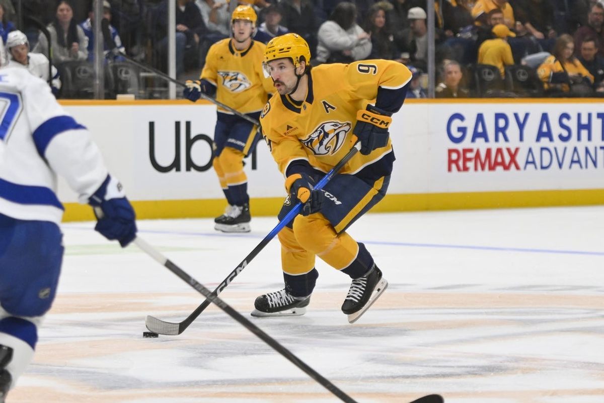 Oct 28, 2025; Nashville, Tennessee, USA;  Nashville Predators left wing Filip Forsberg (9) skates with the puck against the Tampa Bay Lightning during the second period at Bridgestone Arena. Mandatory Credit: Steve Roberts-Imagn Images