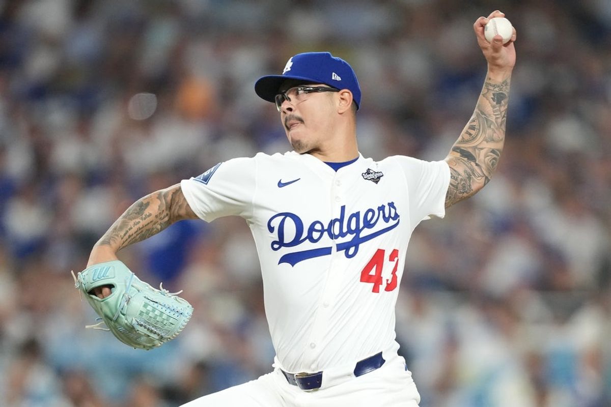 Oct 28, 2025; Los Angeles, California, USA; Los Angeles Dodgers pitcher Anthony Banda (43) pitches against the Toronto Blue Jays in the seventh inning during game four of the 2025 MLB World Series at Dodger Stadium. Mandatory Credit: Kirby Lee-Imagn Images