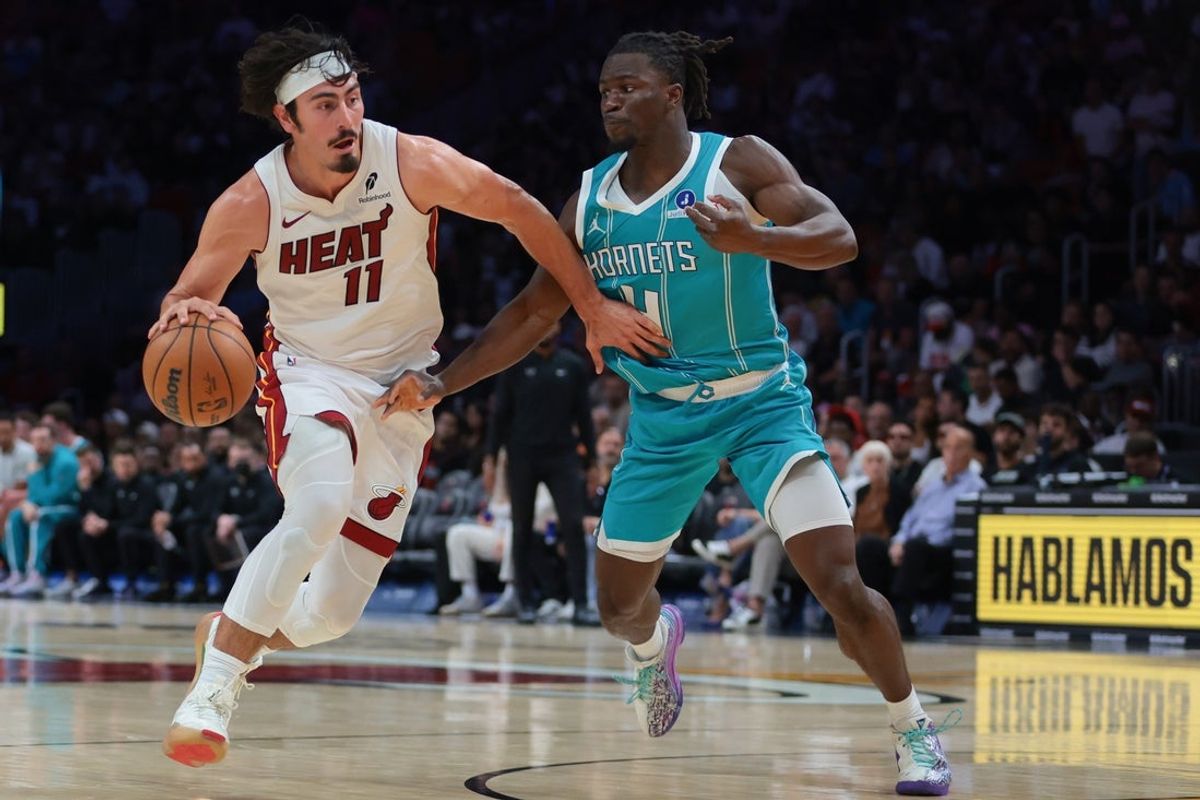 Oct 28, 2025; Miami, Florida, USA; Miami Heat guard Jaime Jaquez Jr. (11) drives to the basket against Charlotte Hornets guard Sion James (4) during the third quarter at Kaseya Center. Mandatory Credit: Sam Navarro-Imagn Images