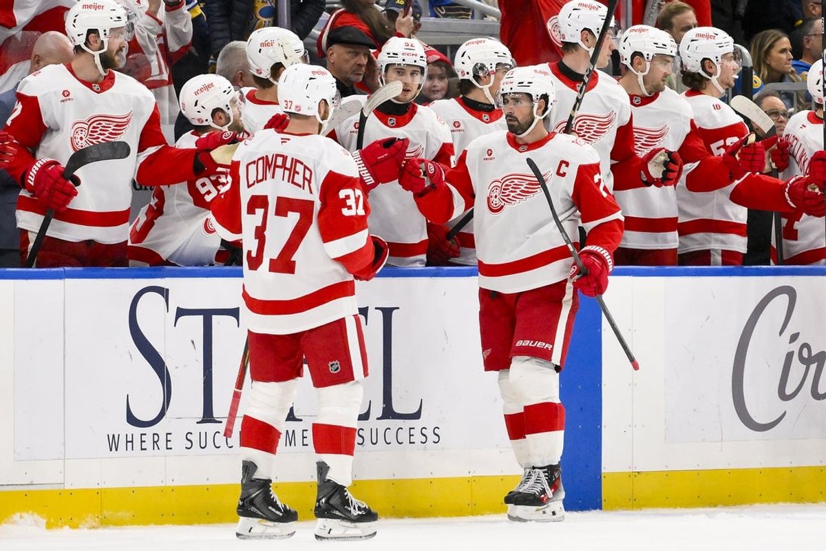 Oct 28, 2025; St. Louis, Missouri, USA; Detroit Red Wings center Dylan Larkin (71) is congratulated by teammates after scoring an empty net goal against the St. Louis Blues during the third period at Enterprise Center. Mandatory Credit: Jeff Curry-Imagn Images