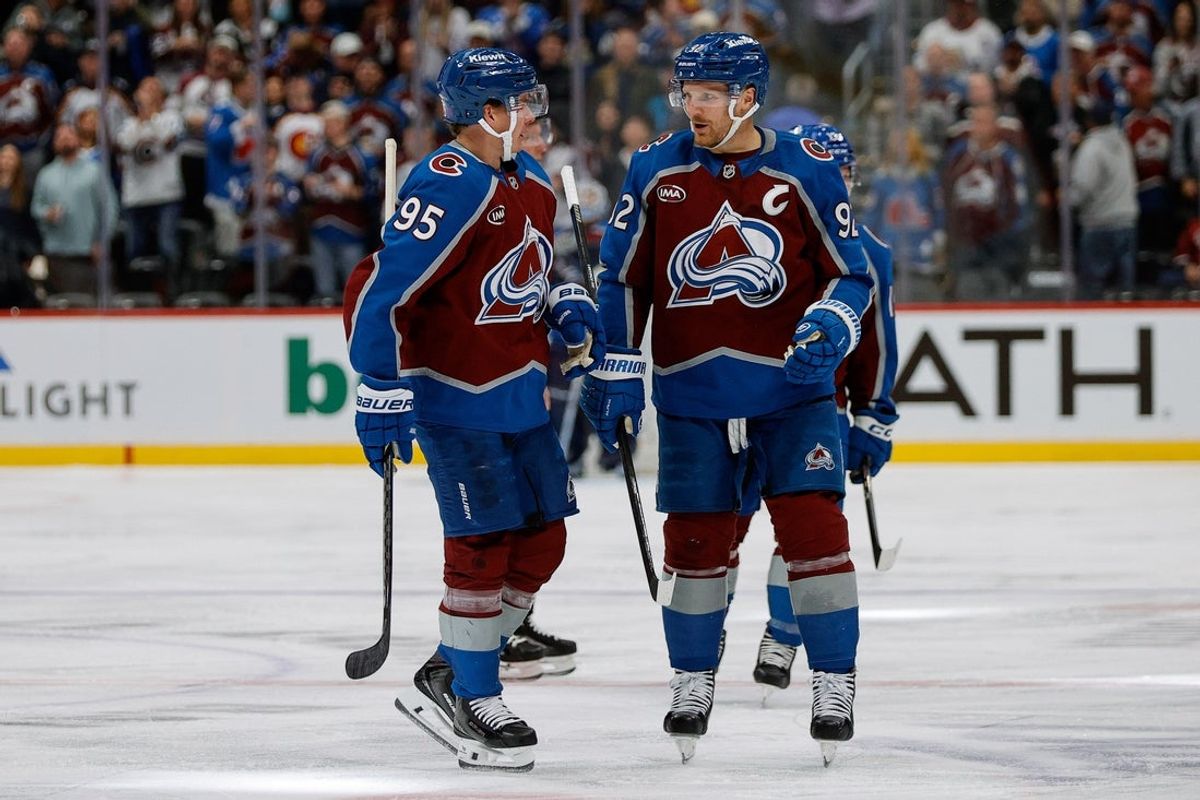 Oct 28, 2025; Denver, Colorado, USA; Colorado Avalanche left wing Victor Olofsson (95) celebrates his goal with left wing Gabriel Landeskog (92) in the second period against the New Jersey Devils at Ball Arena. Mandatory Credit: Isaiah J. Downing-Imagn Images