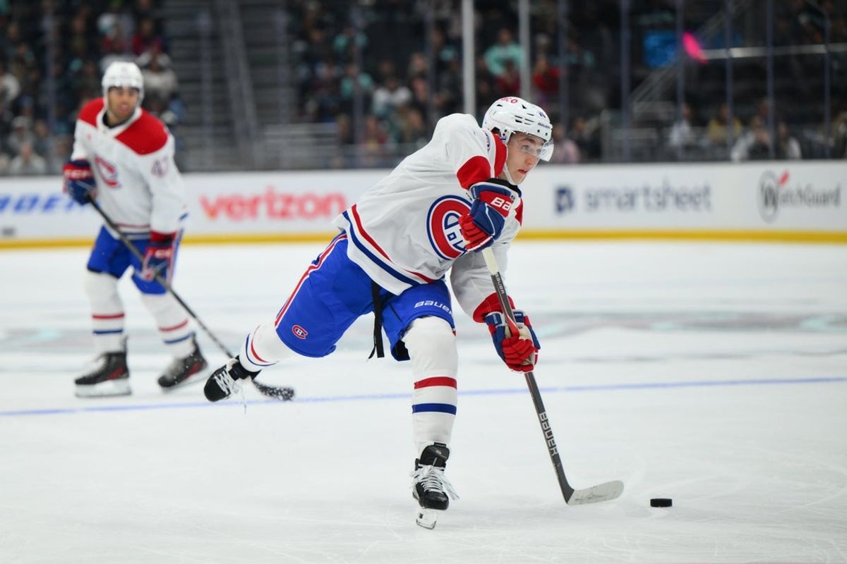 Oct 28, 2025; Seattle, Washington, USA; Montreal Canadiens defenseman Lane Hutson (48) shoots the puck against the Seattle Kraken during the second period at Climate Pledge Arena. Mandatory Credit: Steven Bisig-Imagn Images