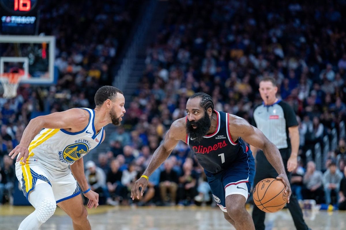 Oct 28, 2025; San Francisco, California, USA; LA Clippers guard James Harden (1) drives to the net against Golden State Warriors guard Stephen Curry (30) during the third quarter at Chase Center. Mandatory Credit: Neville E. Guard-Imagn Images