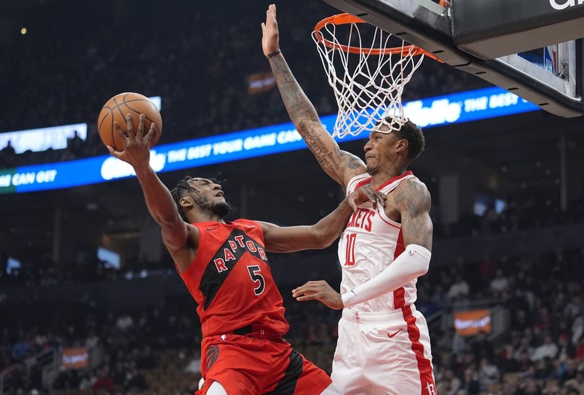 Oct 29, 2025; Toronto, Ontario, CAN; Houston Rockets forward Jabari Smith (10) defends against Toronto Raptors guard Immanuel Quickley (5) during the first half at Scotiabank Arena. Mandatory Credit: John E. Sokolowski-Imagn Images