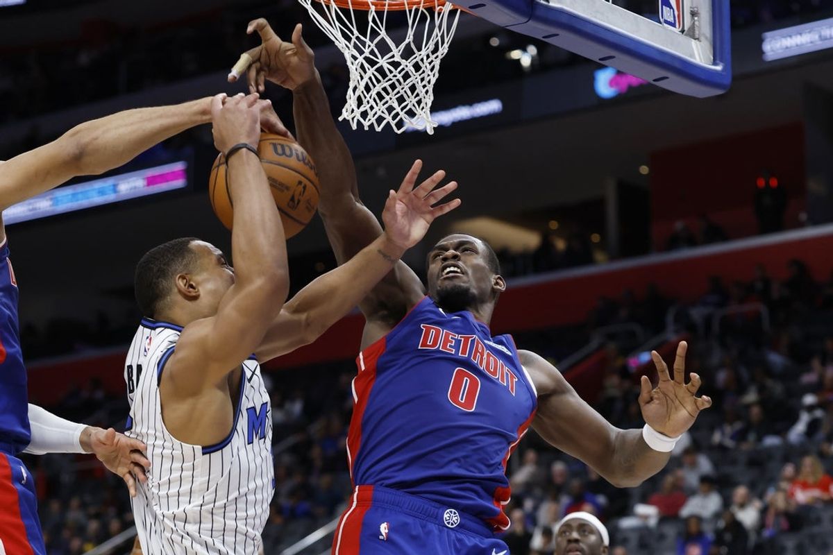 Oct 29, 2025; Detroit, Michigan, USA; Detroit Pistons center Jalen Duren (0) blocks a shot by Orlando Magic guard Desmond Bane (3) in the first half at Little Caesars Arena. Mandatory Credit: Rick Osentoski-Imagn Images