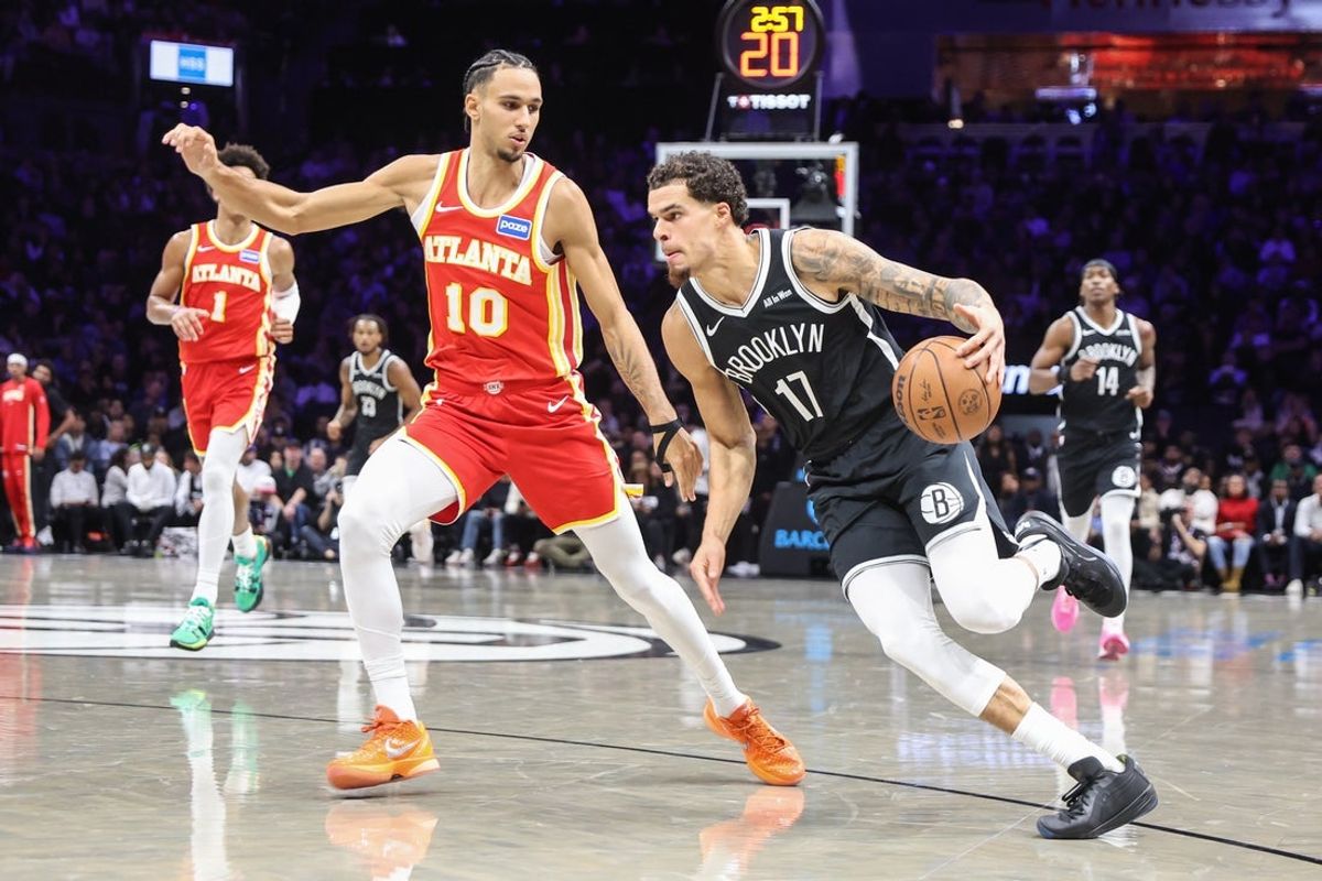 Oct 29, 2025; Brooklyn, New York, USA; Brooklyn Nets forward Michael Porter Jr. (17) looks to drive past Atlanta Hawks forward Zaccharie Risacher (10) in the second quarter at Barclays Center. Mandatory Credit: Wendell Cruz-Imagn Images