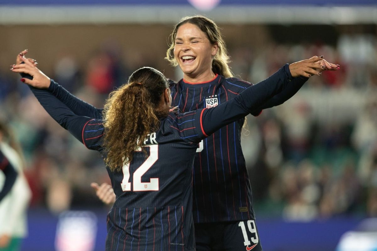 Oct 29, 2025; Kansas City, Missouri, USA; USA forward Michelle Cooper (12) and forward Emma Sears (19) celebrate after a goal by Sears in the first half of the match against New Zealand  at CPKC Stadium. Mandatory Credit: Kylie Graham-Imagn Images