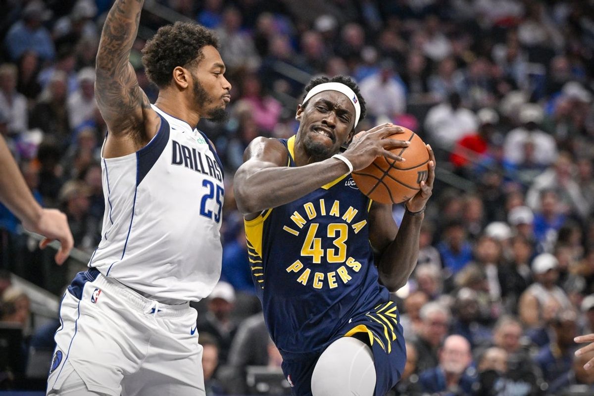 Oct 29, 2025; Dallas, Texas, USA; Indiana Pacers forward Pascal Siakam (43) drives to the basket against Dallas Mavericks forward P.J. Washington (25) during the second quarter at the American Airlines Center. Mandatory Credit: Jerome Miron-Imagn Images
