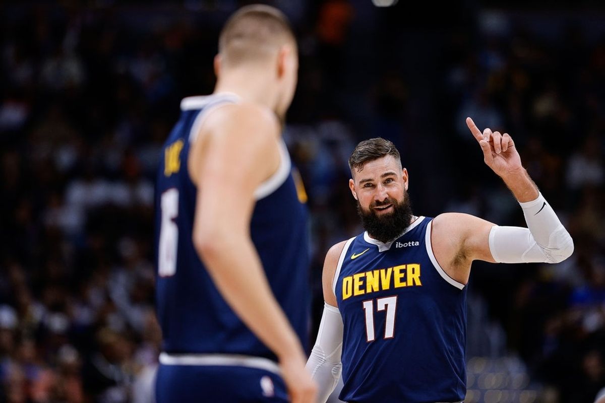 Oct 29, 2025; Denver, Colorado, USA; Denver Nuggets center Jonas Valanciunas (17) gestures as center Nikola Jokic (15) looks on in the second quarter against the New Orleans Pelicans at Ball Arena. Mandatory Credit: Isaiah J. Downing-Imagn Images