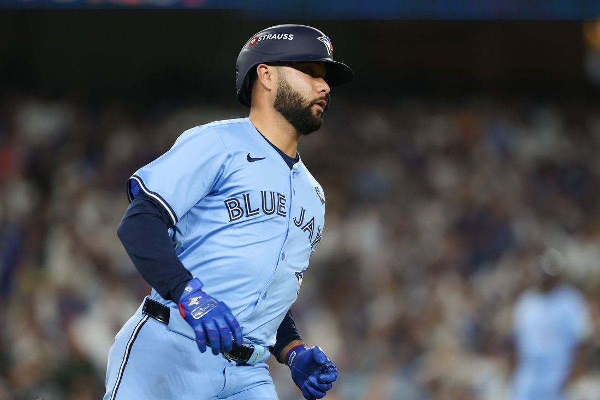 Oct 29, 2025; Los Angeles, California, USA; Toronto Blue Jays second baseman Isiah Kiner-Falefa (7) runs to first base after hitting a single during the eighth inning against the Los Angeles Dodgers during game five of the 2025 MLB World Series at Dodger Stadium. Mandatory Credit: Kiyoshi Mio-Imagn Images