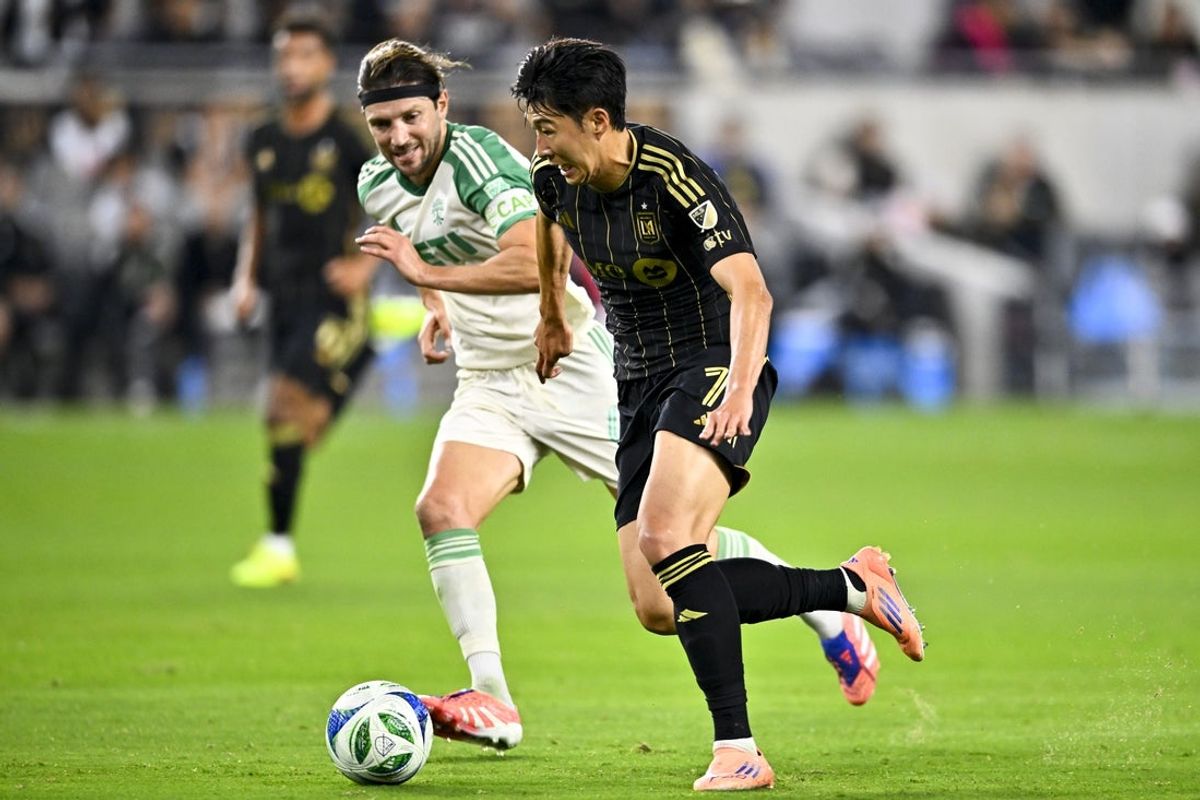 Oct 29, 2025; Los Angeles, California, USA; Los Angeles FC forward Son Heung-Min (7) moves the ball past Austin FC midfielder Ilie Sánchez (6) during the first half at BMO Stadium. Mandatory Credit: Kelvin Kuo-Imagn Images