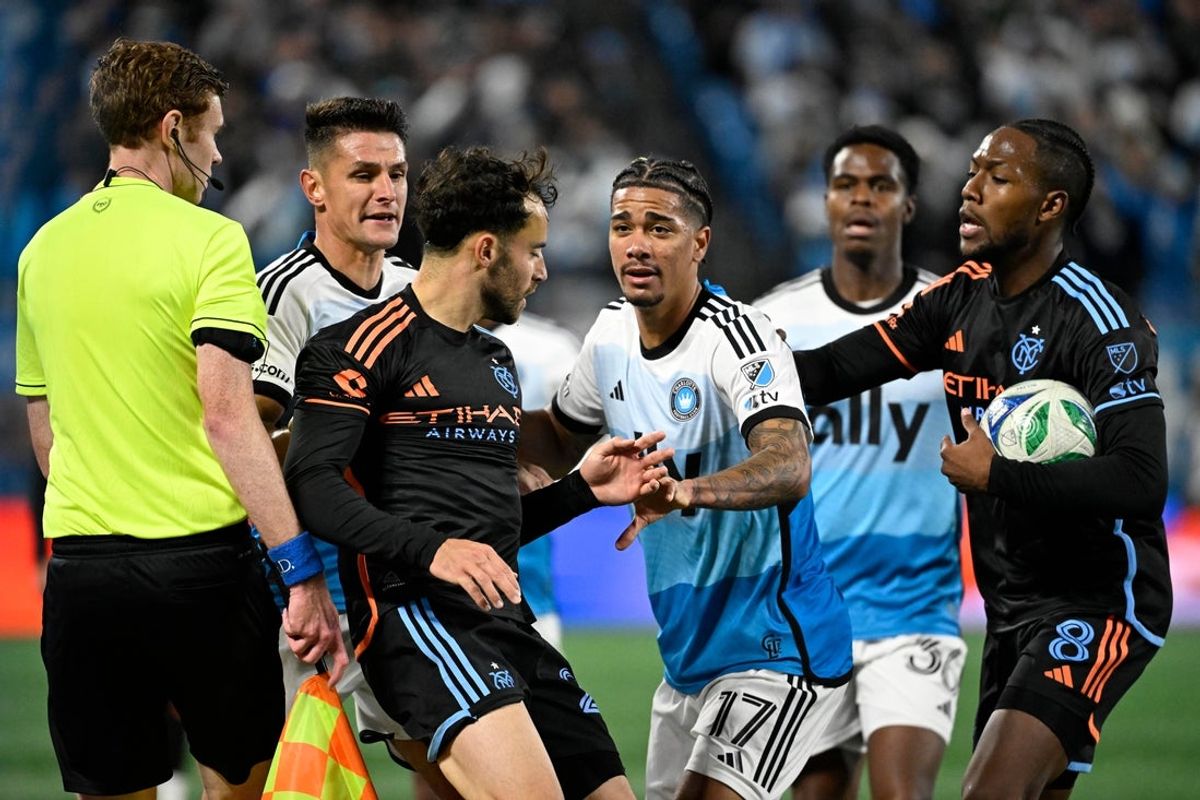 Oct 28, 2025; Charlotte, North Carolina, USA; Charlotte FC midfielder Ashley Westwood (8) and forward Idan Toklomati (17) argue with New York City forward Kevin O'Toole (22) and midfielder Andres Perea (8) in the second half at Bank of America Stadium. Mandatory Credit: Bob Donnan-Imagn Images