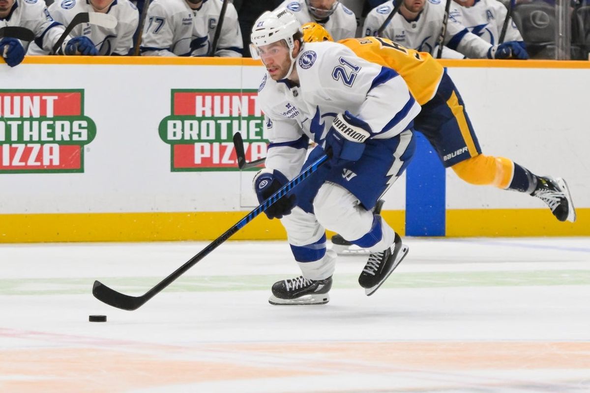 Oct 28, 2025; Nashville, Tennessee, USA;  Tampa Bay Lightning center Brayden Point (21) skates with the puck against the Nashville Predators during the second period at Bridgestone Arena. Mandatory Credit: Steve Roberts-Imagn Images