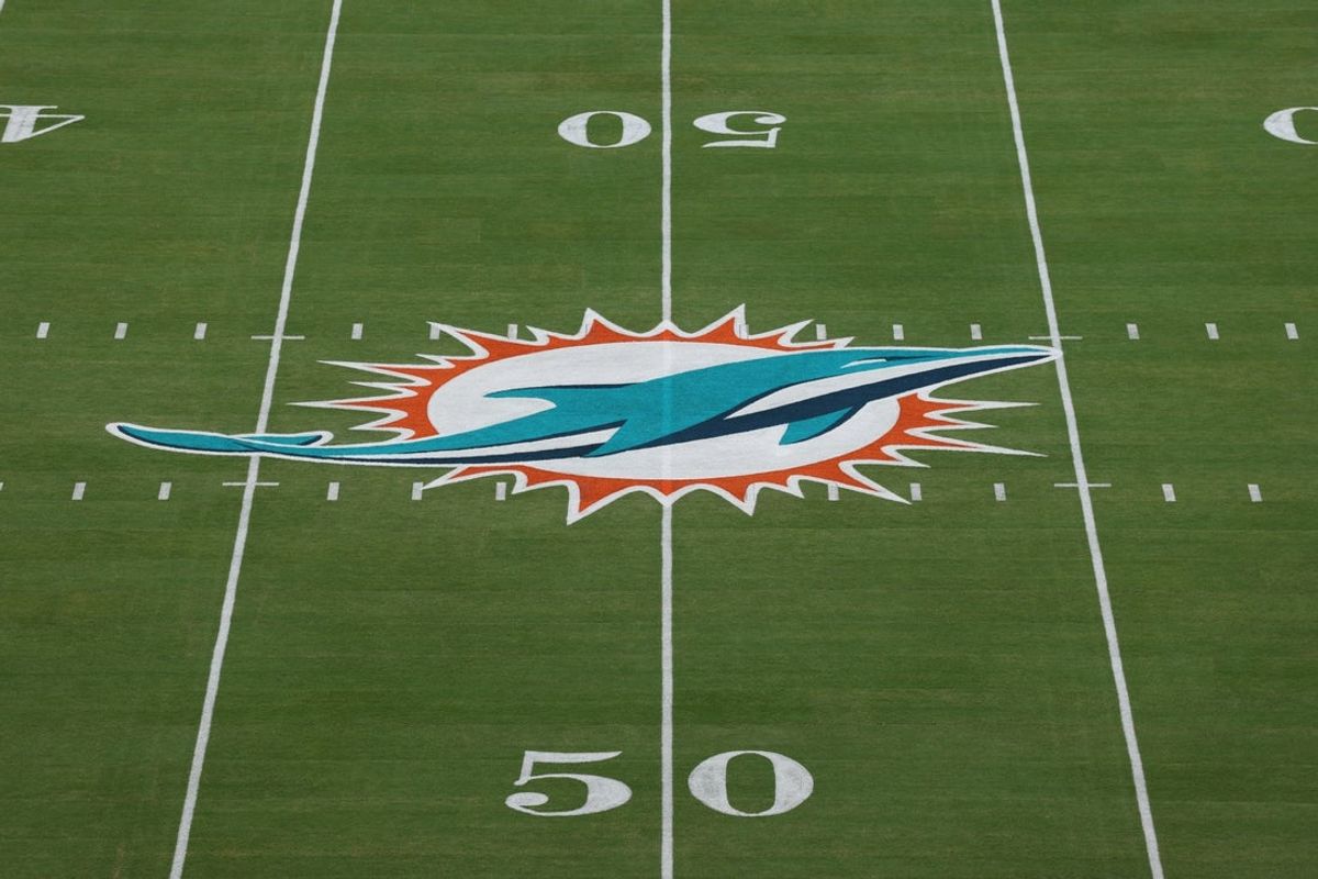 Oct 30, 2025; Miami Gardens, Florida, USA; The Miami Dolphins logo is seen at midfield prior to a game against the Baltimore Ravens at Hard Rock Stadium. Mandatory Credit: Nathan Ray Seebeck-Imagn Images