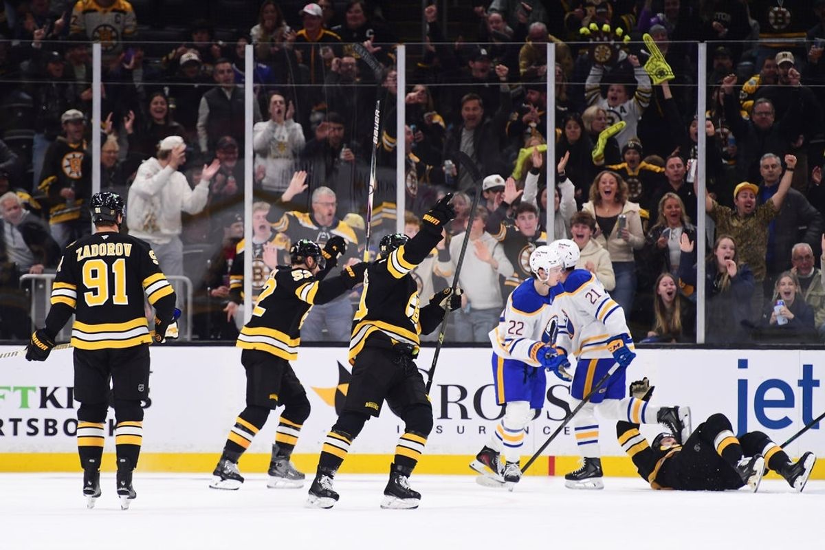 Oct 30, 2025; Boston, Massachusetts, USA;  Boston Bruins center Mark Kastelic (47) (lying on ice) reacts after scoring a goal during the second period against the Buffalo Sabres at TD Garden. Mandatory Credit: Bob DeChiara-Imagn Images