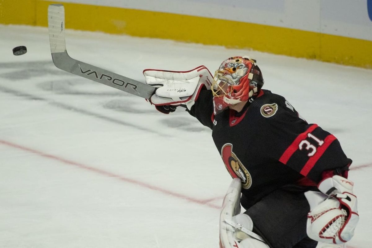 Dec 2 2023; Ottawa, Ontario, CAN; Ottawa Senators goalie Anton Forsberg (31) clears the puck in the third period against the Seattle Kraken at the Canadian Tire Centre.