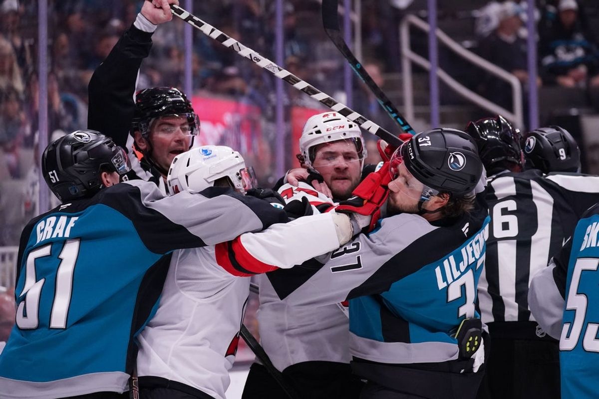 Oct 30, 2025; San Jose, California, USA;  San Jose Sharks right wing Collin Graf (51) and defenseman Timothy Liljegren (37) scuffle with New Jersey Devils center Luke Glendening (14) and left wing Paul Cotter (47) in the second period at SAP Center at San Jose. Mandatory Credit: David Gonzales-Imagn Images