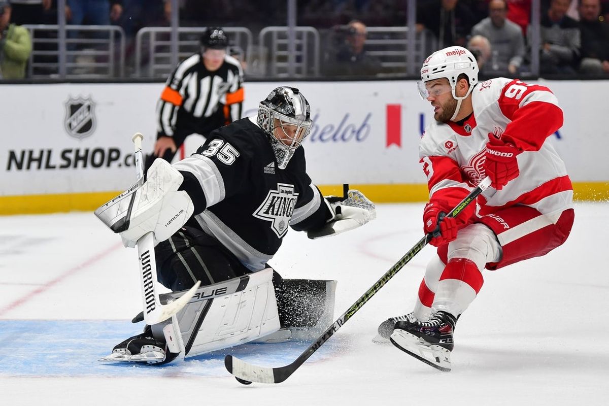 Oct 30, 2025; Los Angeles, California, USA; Los Angeles Kings goaltender Darcy Kuemper (35) blocks the shot of Detroit Red Wings right wing Alex Debrincat (93) during the shootout at Crypto.com Arena. Mandatory Credit: Gary A. Vasquez-Imagn Images