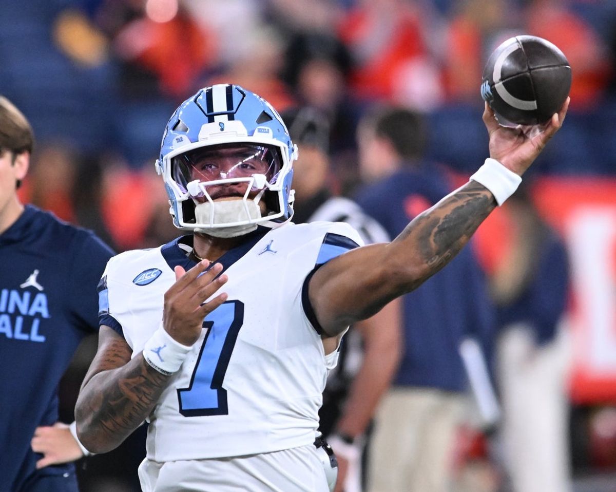 Oct 31, 2025; Syracuse, New York, USA; North Carolina Tar Heels quarterback Gio Lopez (7) warms up before a game against the Syracuse Orange at the JMA Wireless Dome. Mandatory Credit: Mark Konezny-Imagn Images