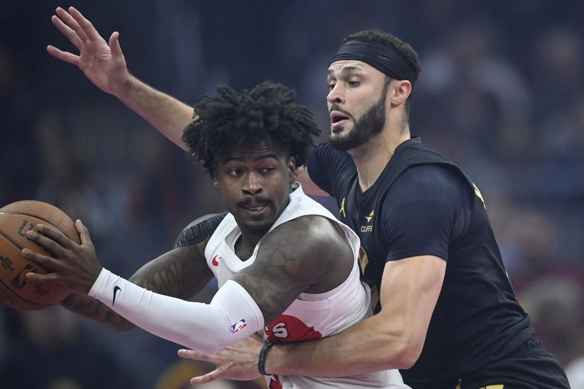 Oct 31, 2025; Cleveland, Ohio, USA; Cleveland Cavaliers forward Larry Nance Jr. (22) defends Toronto Raptors guard Jamal Shead (23) in the first quarter at Rocket Arena. Mandatory Credit: David Richard-Imagn Images